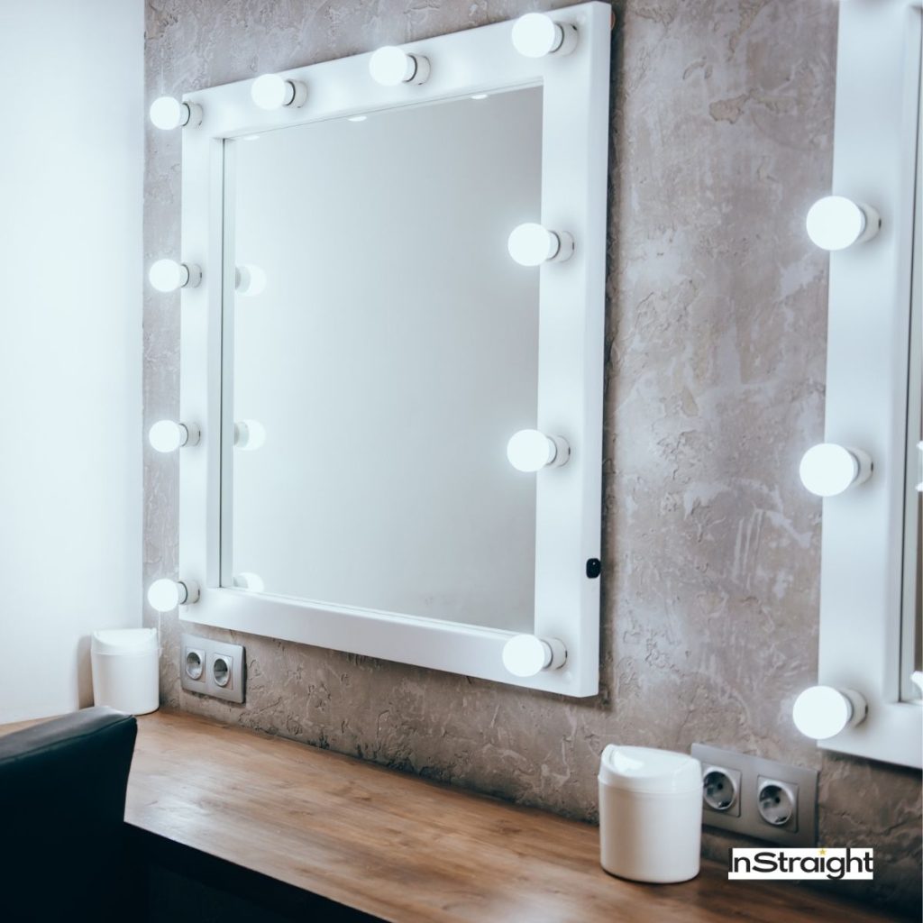 lighted mirrors with lights round it under title What Type of Mirror is Used in Bathrooms